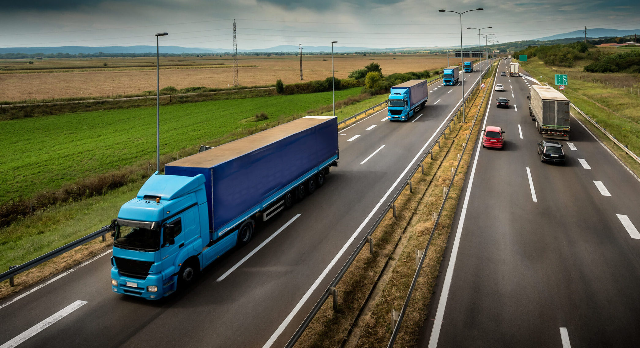 A fleet of vehicles traveling on the motorway.